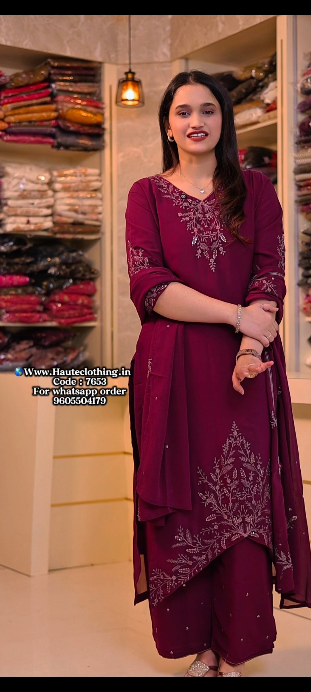 7653